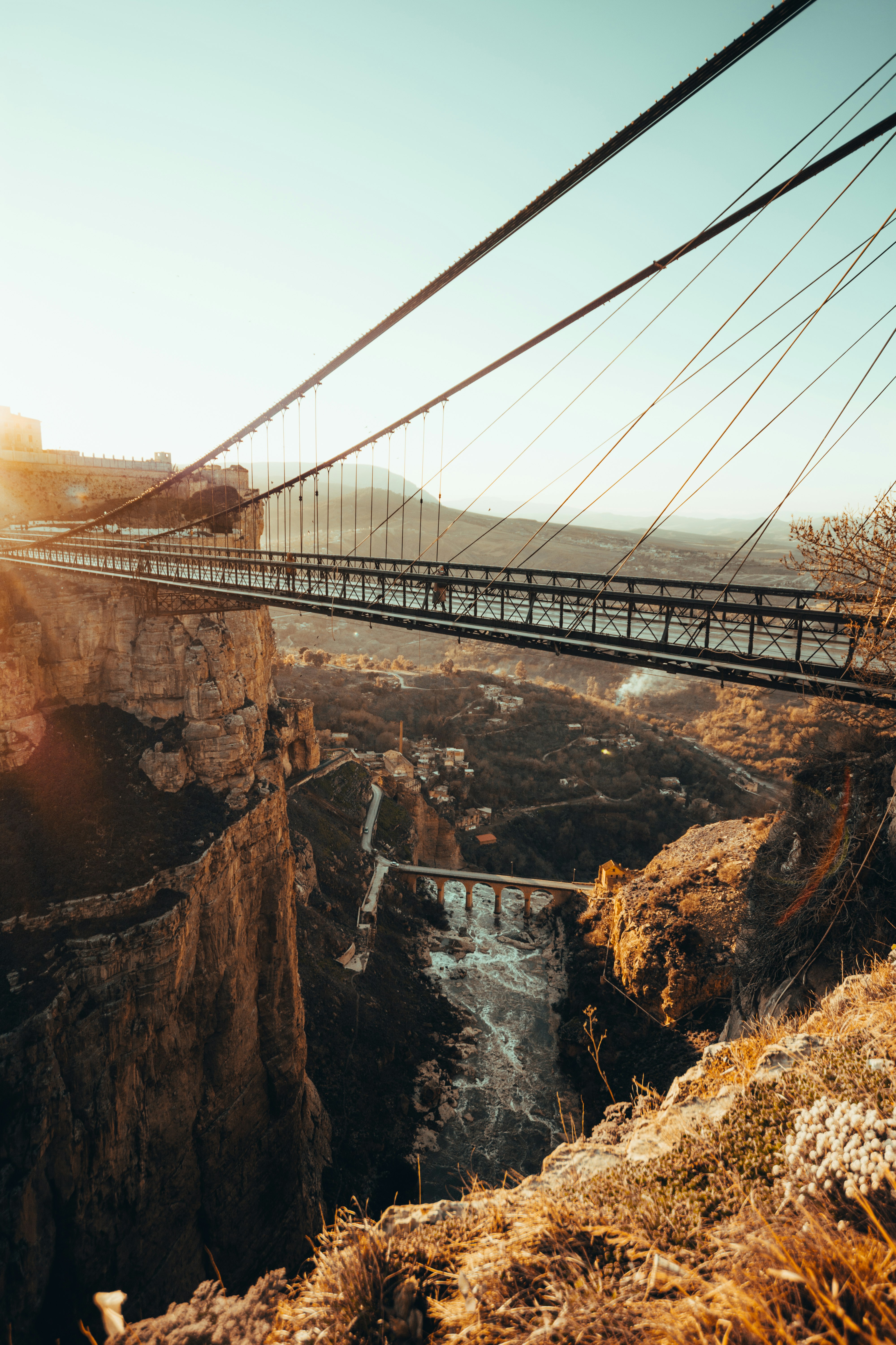 brown bridge over river during daytime